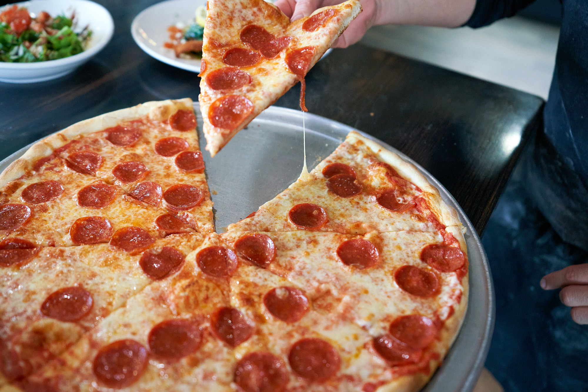 Fresh hand-tossed veggie pizza at Rico's Pizzeria